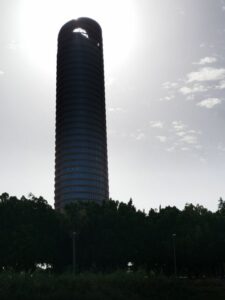 Torre Seville with the sun shining through the opening at the top