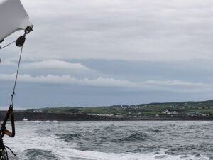 From the boat on the way to visit the Cliffs of Moher looking back at Doolin and Nagles camping and caravan park