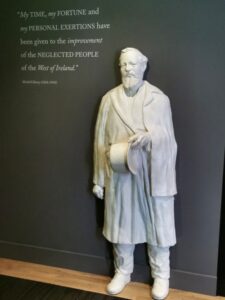 A life size statue of Mitchell Henry inside Kylemore Abbey