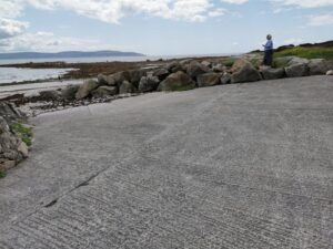 Dionee enjoying a break from driving and the view over Galway Bay at Bearna Harbour