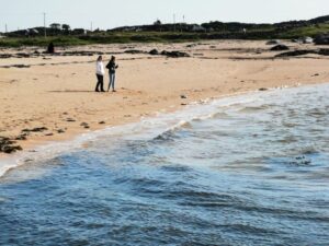 Fran and Mil on the golden sands of Mannin Bay Blueway beach