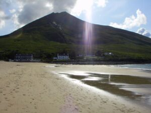 Slievemore in the early evening sun with the tide out at Dugort beach