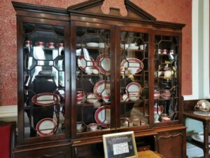 The dining set in a cabinet in the dining room Kylemore Abbey