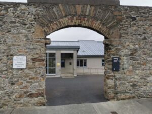 A modern building within an ancient stone wall in Belmullet