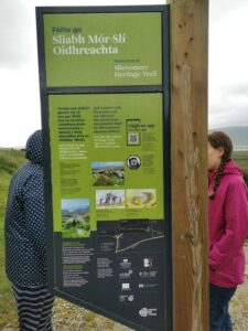Dionee and Matilda at the signpost at the Deserted Village Achill Island - we met a tour guide here