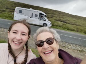 Matilda and Nanny Teresa on the windy hill above Keel with the CaraMotorhome campervan in behind