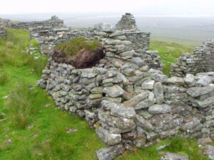 Some of the deserted village houses high above the lowlands of Keel Beach