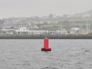 A misty Dingle town seen over the yacht harbour from out on Dingle Bay in our tour boat