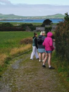 Dionee and the girls walking along the track towards the exit to the Gallarus Oratory