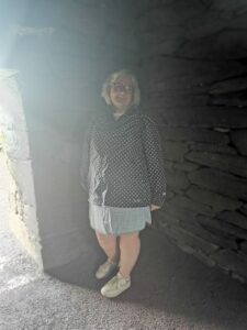 Dionee inside the light filled Gallarus Oratory