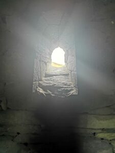 Light plays through the window of Gallarus Oratory