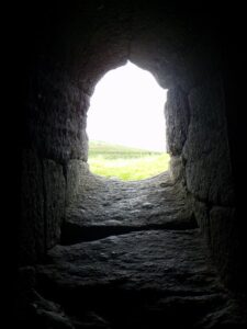 The view through a window in Gallarus Oratory and the thickness of the wall