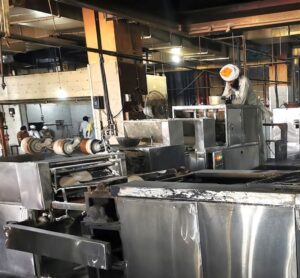 A chapati making machine in the Langar at Ramgarhia Bunga