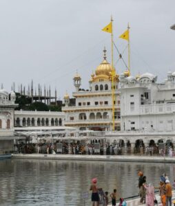 Akal Takht built in 1606, with a large number of pilgrims in the line for blessing in the Golden Temple