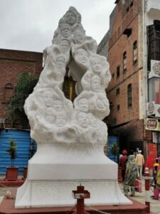The white marble statue, The Flame of Liberty, near the narrow entrance to Jallianwala Bagh