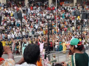 Women participating in the warm up the crowd entertainment before the border spectacle