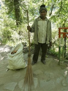 A track sweeper on the trek to Gangaria base camp, Himalayan India