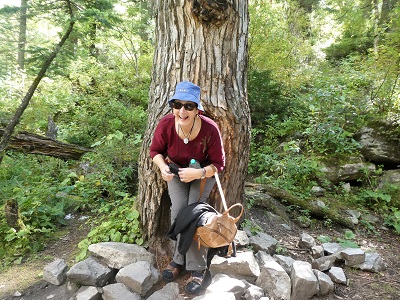 Having fun fitting into a hollow tree trunk, Valley of Flowers Track