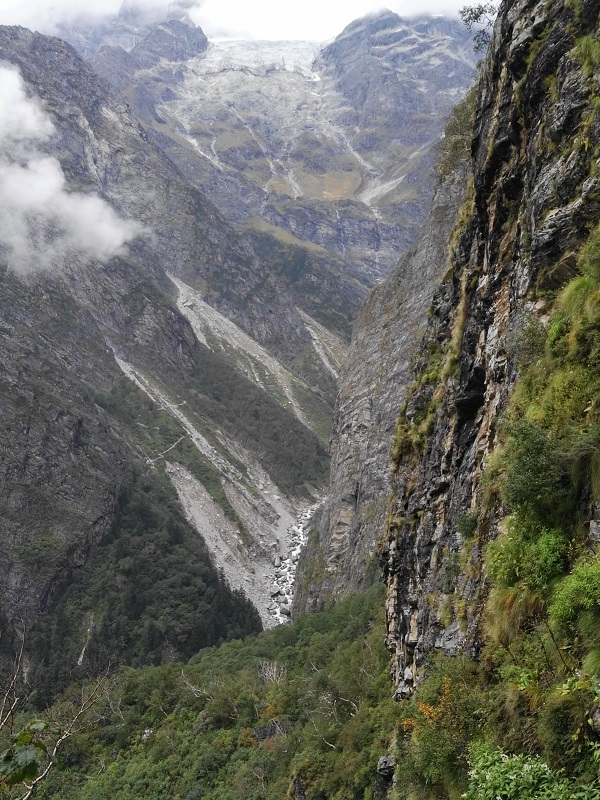 Sheer rock walls, deep ravines, the high track int eh valley of the flowers with the river far below - from Hemkund, Himalayan India