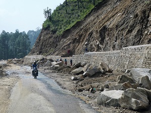 Creating rock retaining walls on the road to Gwaldam, Himalayan India