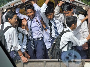 School boys in the back of a small bus near Nanital, Himalayan India