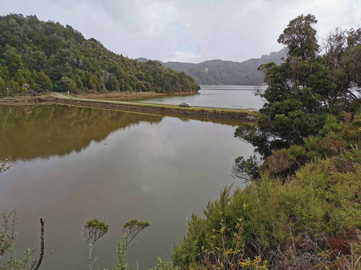 Car on causeway, Whanganui Inlet Golden Bay