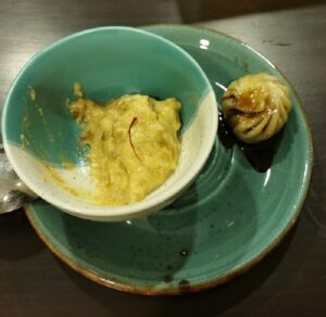 Chocolate Momos and another dish with a strand of safron on top
