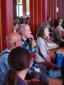 Manfred Andy and Kaya listening to teachings at KIBI India