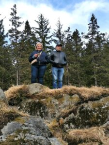 Dionee and Marcus watching the twins in the adventure playground from the Troll Hill Mt Fløyen