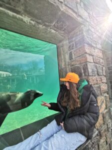 Matilda enjoying connecting and communicating with a seal at Bergen Aquarium