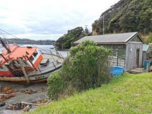 Leask Bay, the Iconic boat and the road beyond to Ackers Point