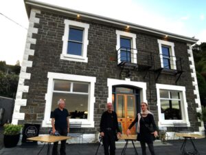 The three friends Andy, Manfred and Leonetta outside the Carey's Bay Historical Hotel