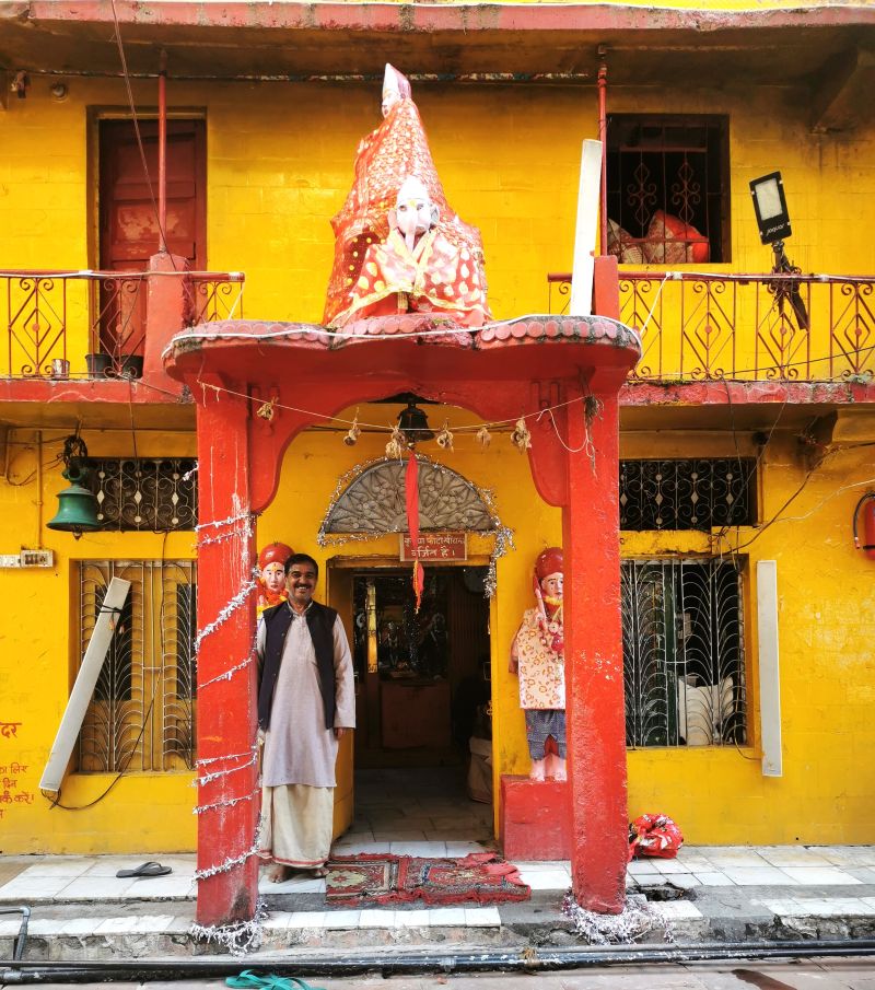 A fellow pilgrim asked to pose in front of a small side temple Yamunotri