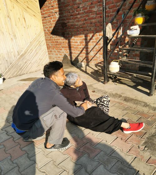 Kartik & Shoba with one of the cats at Chanshal Camps & Resort, in the area of Chirgaon