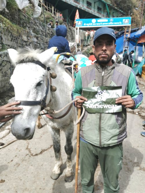 LakshmiNarayan and Raja with the Norswear sign at Yamunotri