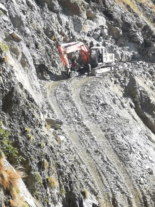One of the big machines clearing the hillside slip