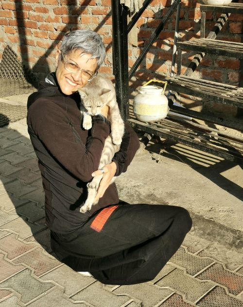 Shoba cuddling up to one of the cats at Chanshal Camps & Resort, in the area of Chirgaon