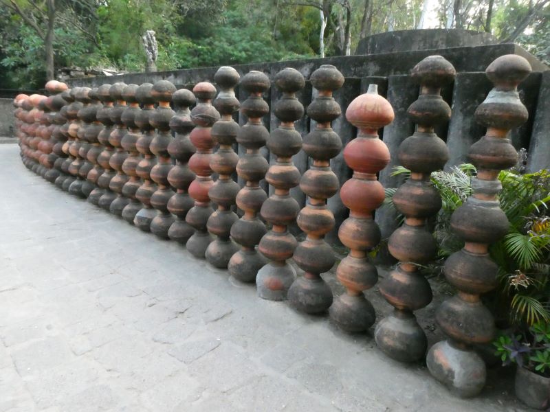 Terracota water pots used in a creative sculpture at Rock Garden Chandigarh