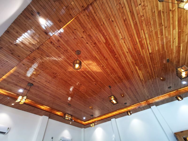 The amazing ceiling of the restaurant in Rohru with polished wood and modern lighting
