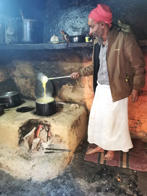 The cook showing me his curry at Yamunotri