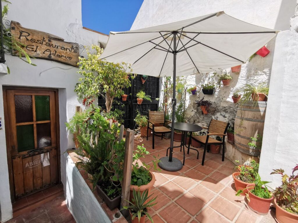 A table in the courtyard of El Agarve restaurant in Frigiliana