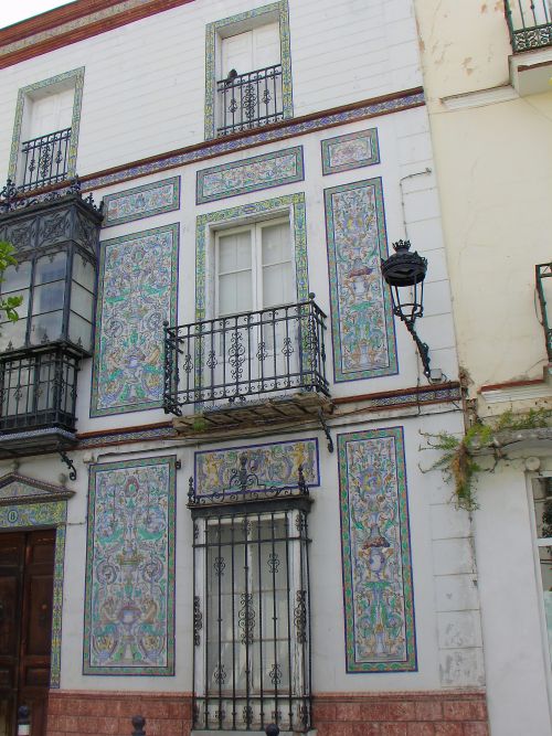 A building in La Plaza Ubrique decorated with mosaic tiles