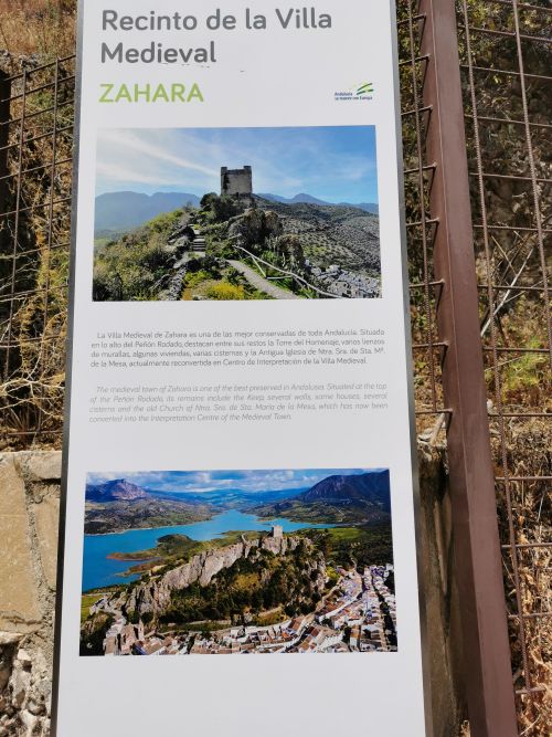 A signboard showing the 'castle on the hill' check out the cliff below the castle - Zahara de la Sierra