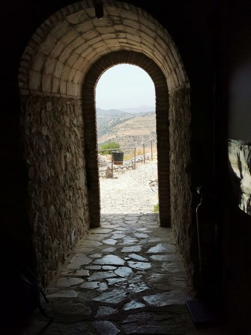 From the inside looking out of the entrance door of the castle on the hill Zahara de la Sierra
