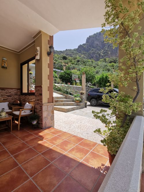 From the veranda towards the stairs to the pool area and the Tajo AlgarÃn up behind