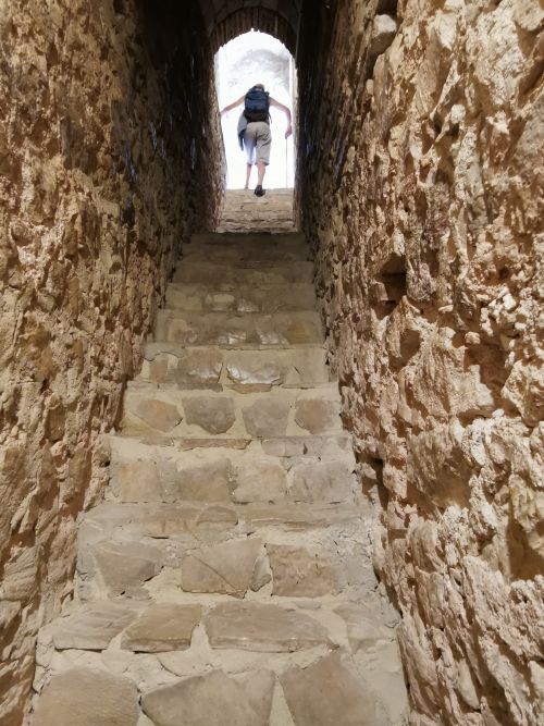 Manfred climbing the narrow steep stairs to the top of the castle on the hill Zahara de la Sierra