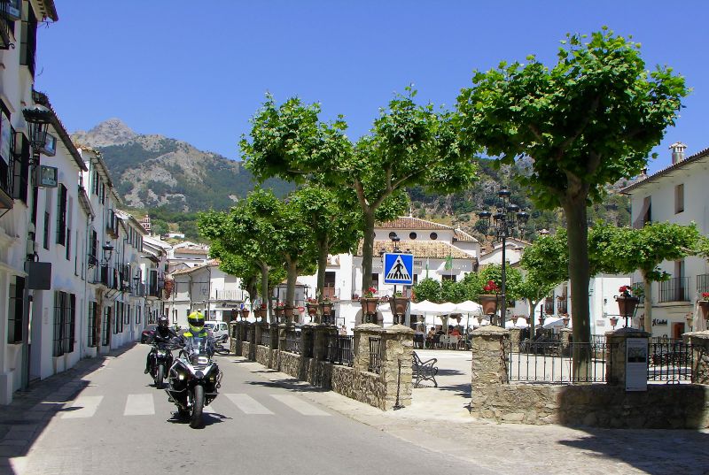 Motorbike travellers passing by the Plaza de España, Grazalema