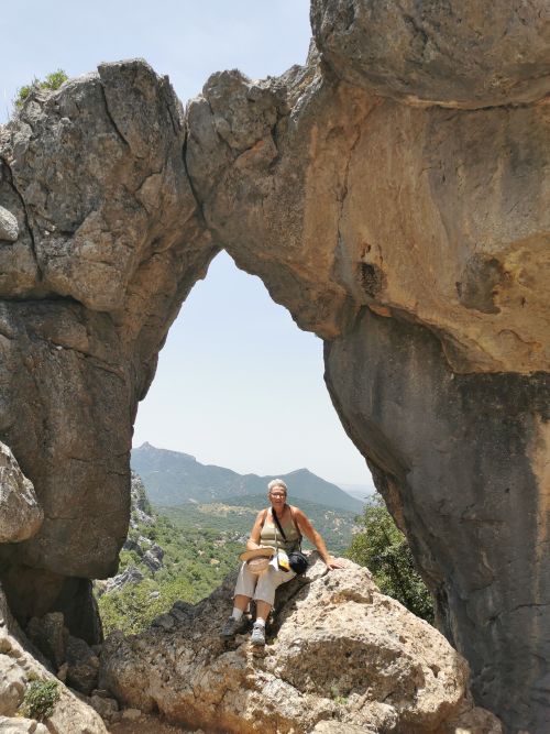 Teresa in the Ojo del Moro - Eye of the Moor with the expansive view behind