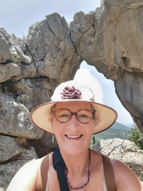 Teresa in the Ojo del Moro - Eye of the moor with a big white cloud behind