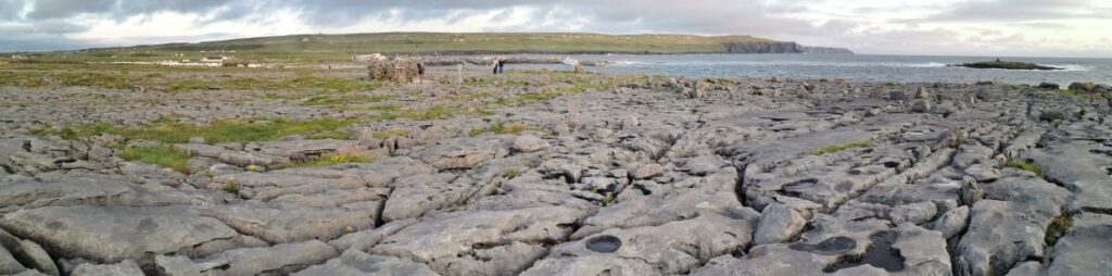 A panorama of the rocks, the ocean and the Cliffs of Moher near Doolin